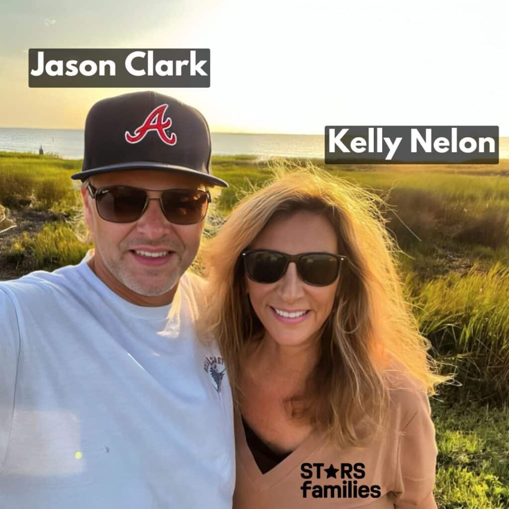 Jason Clark with his wife Kelly Nelon Clark, both are wearing sun glasses. 