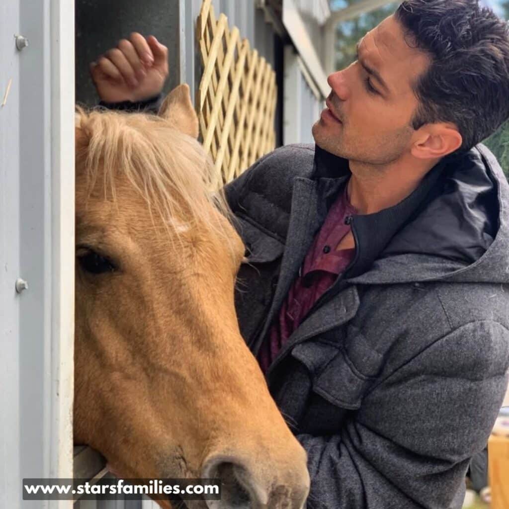 Ryan Paevey cuddling with the horse. 