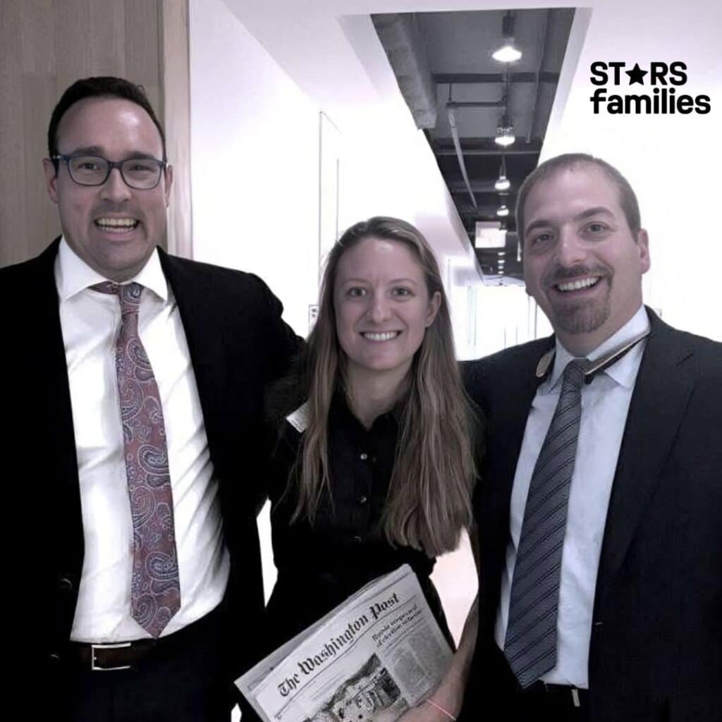 Chuck Todd, wearing a suit with a white shirt and a patterned tie, stands with two individuals in a hallway. The person in the middle is holding a copy of "The Washington Post" newspaper, while the person on the right is in a suit with a white shirt and a striped tie. The background features a ceiling with exposed pipes and lights.