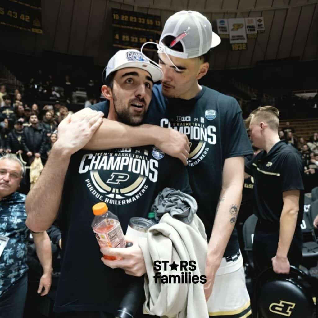 Zach Edeywith his brother. both are wearing black shirts. 