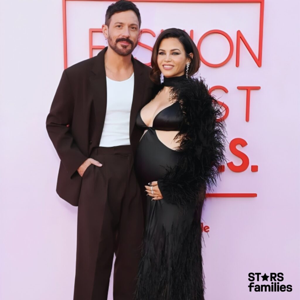 Pregnant Jessica Alba and husband  at the 2019 Fashion Awards, showcasing their stylish looks and happy smiles.