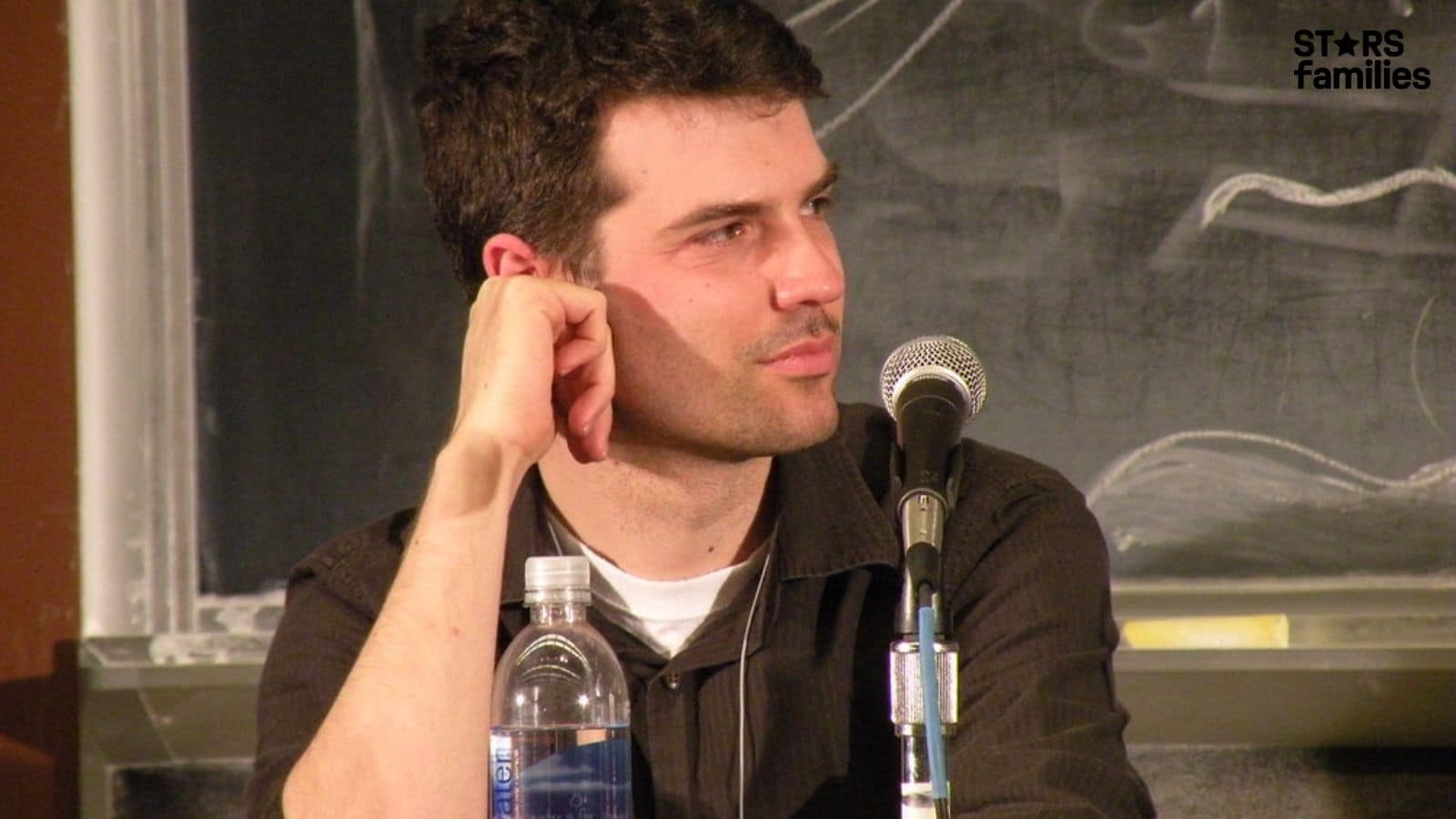 Aaron Peckham speaking at a panel discussion, founder of Urban Dictionary, a notable tech entrepreneur linked to Aaron Peckham net worth.